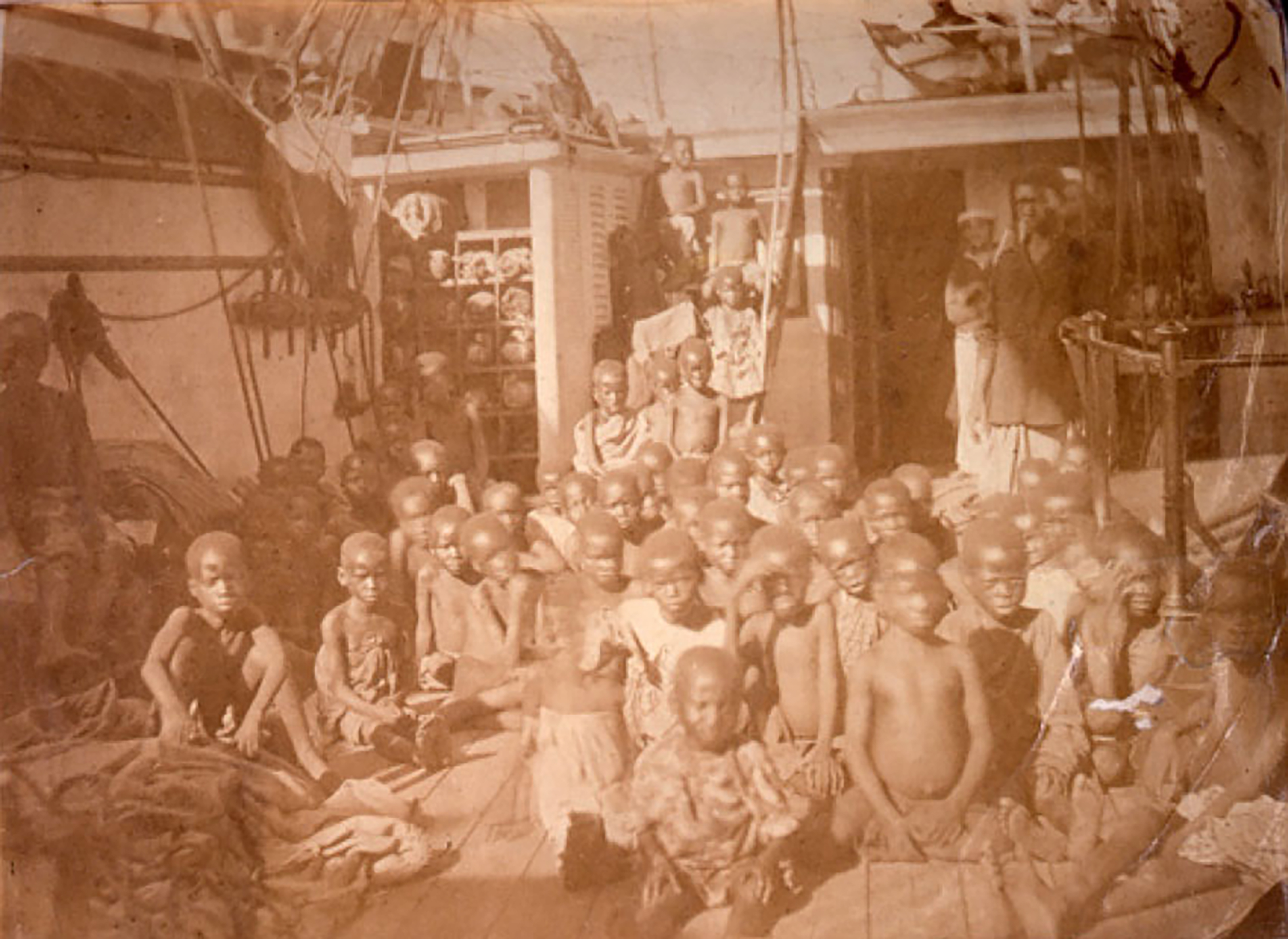 The British Navy's Daphne captured at least thirteen dhows amounting to over 650 "Liberated Africans" in 1868. This photograph shows children sitting on the deck of the Daphne after being seized from the dhows. Having left Zanzibar, they were captured in the Indian Ocean and taken to the Seychelles where they were indentured. Source: The National Archives, UK, FO 84/1310, 1869, f. 193-195.